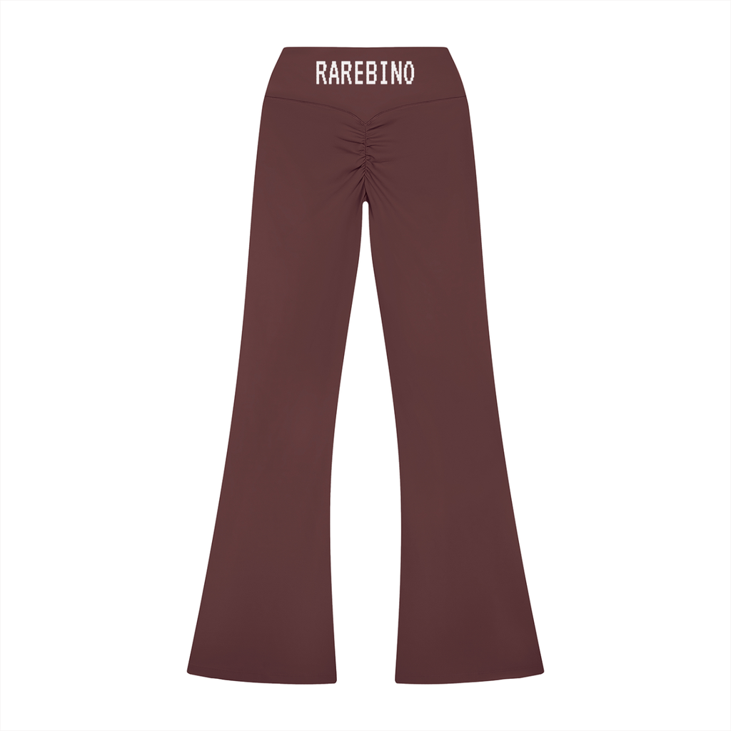 Rarebino high rise flared leggings displayed on a model, showcasing the fitted waistband and flowing flared leg design.