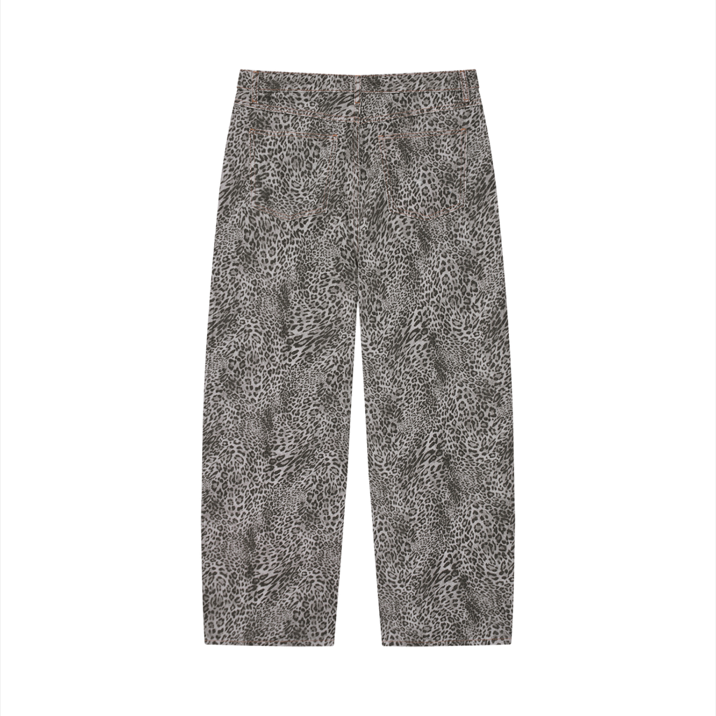 Vintage wash leopard print wide leg jeans by ODMPOD featuring retro style and relaxed fit.